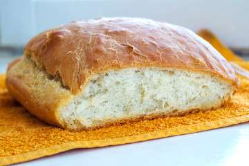 Home bread. Cooking food in quarantine, self-isolation. Rustic bread on a towel