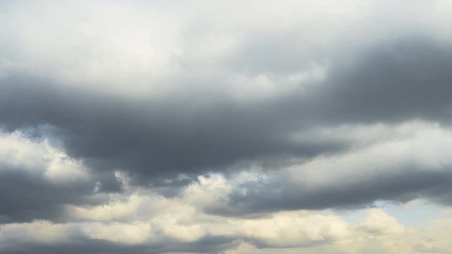 Dramatic movement of thunderclouds in early spring against the background of blue sky. 4K TimeLapse.