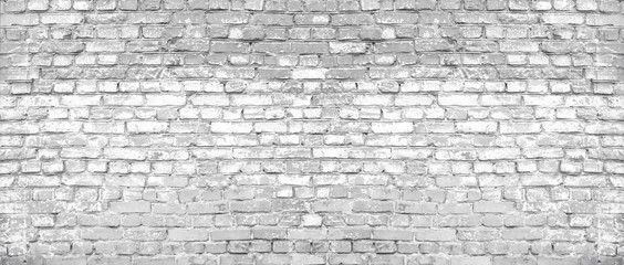 White washed old shabby brick wall wide texture. Large light gray rustic brickwork. Whitewashed widescreen vintage background