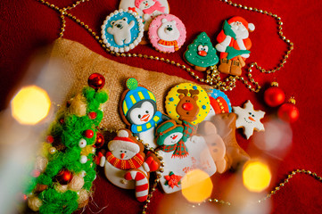 Christmas tree and gingerbread cookies on a red background