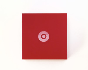 A bright red box with a shiny gradient circle in the center on a white background. Empty space. Mockup. Stylized stock photos.