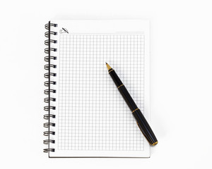 Empty stylish spiral Notepad for notes and a beautiful corporate pen on a white background. Empty space. Stylized stock photos. The view from the top.