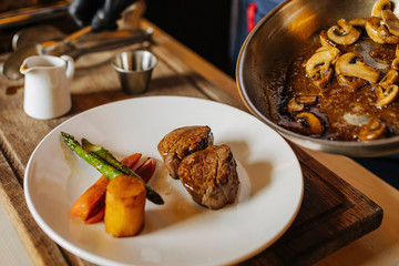 Portion of meat with vegetables