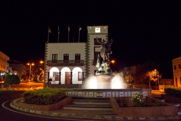 Tazacorte town hall and a fountain lit up at night