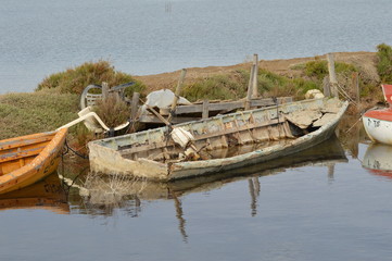 A small old brown boat in the sea