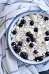 Cottage cheese in bowl,Homemade curd cheese served with fresh berries