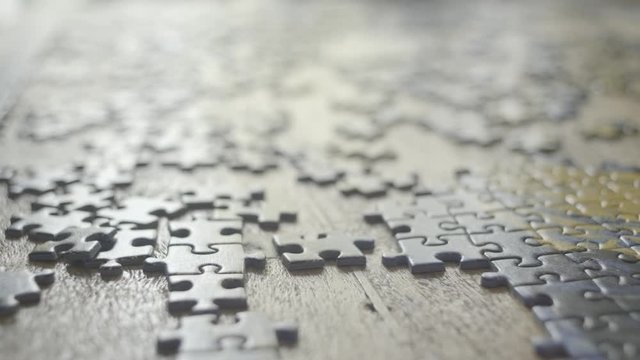 Jigsaw puzzle pieces change focus. close up