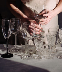 wine glasses sunlight shadow sun wine different glare hand woman white black background