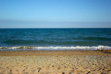 waves on the beach with blue sky