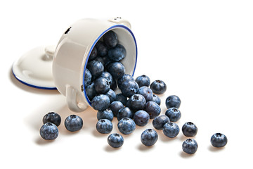 Blueberry in ceramic bowl isolated on white. Fresh blueberry closeup, healthy diet nutrition concept. Ripe organic bilberry, vegan meal. Juicy blueberries background.