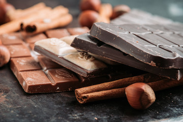Chocolate bar on the rustic background. Selective focus. Shallow depth of field.