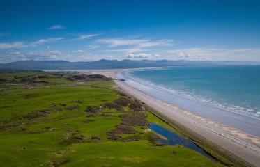 Aerial view of Criccieth Beach and Snowdonia Mountains, Wales, UK