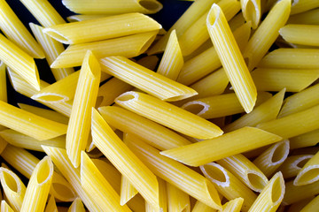 Various macaroni products on a blue background