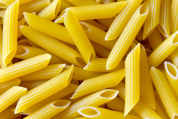 A bunch of yellow macaroni close up