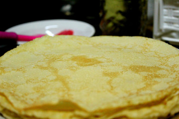 fried thin pancakes on a plate