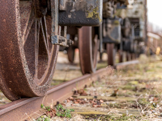 wheels on a vintage train wagon. old red vintage train wagon.
