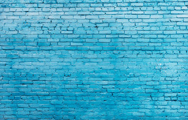 Old blue painted brick wall texture or background. High contrast and resolution image with place for text. Template for design