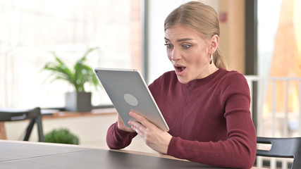 Happy Young Woman Surprisd by Results on Tablet, Wow