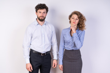 A man and A woman in business style clothing, white background, confused, a little lost