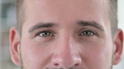 Close Up of Blinking Eyes of Young Man