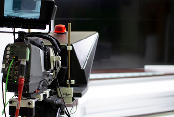 TV camera in the Studio. Teleprompter and professional high-definition video camera on a tripod.