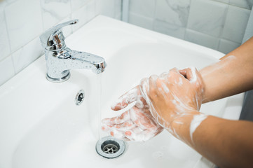 Close up Male hands washing hands with soap. for corona virus prevention.