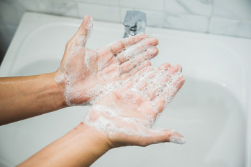 Close up Male hands washing hands with soap. for corona virus prevention.