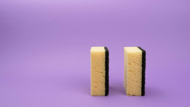 Sponge for washing dishes on a purple background.