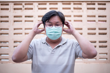 Men are wearing the mask on the face for protection Prevent infection and viruses (COVID-19)