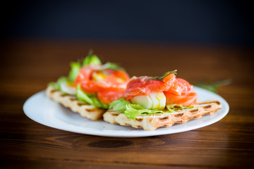 fried bread toast with salad leaves and salted red fish