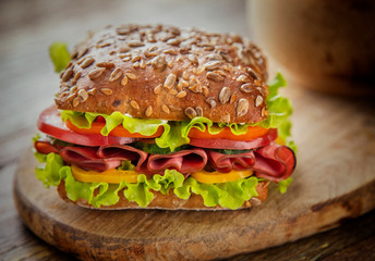 
Ham and cheese sandwich on a wooden table