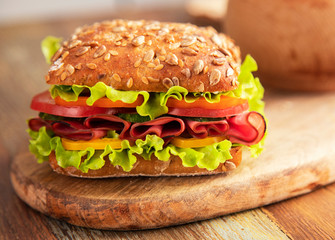 
Ham and cheese sandwich on a wooden table