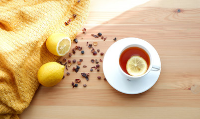 tea with lemons on a wooden table. Beautiful background mockup