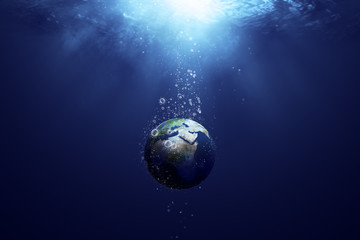 Obraz na płótnie Canvas globe sinking in the deep sea, with the bubbles in coronavirus shape, idea, conceptual images.