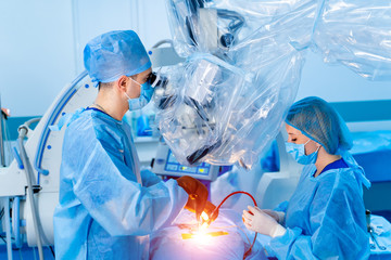 Team surgeon at work in operating room. Modern equipment in operating room. Medical devices for...