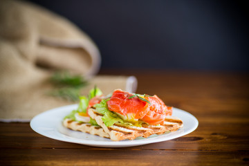 fried bread toast with salad leaves and salted red fish