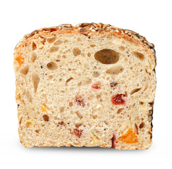 Slice of bread with inclusions of fruits and seeds on a white isolated background.