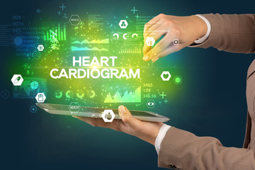 Close-up of a touchscreen with HEART CARDIOGRAM inscription, medical concept