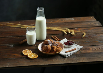 Beautiful serve on a wooden table homemade cookies with milk