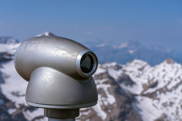 .Binoculars on the observation deck of Les Diablerets on a sunny summer day