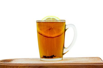 glass cup of tea with lemon on a white background