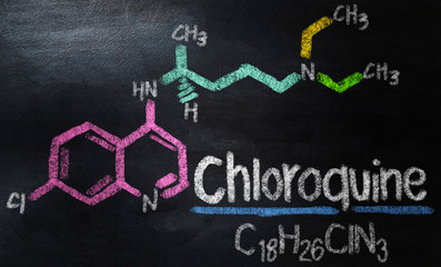 chemical formula of Chloroquine on chalkboard