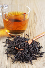 Cup of tea with dried large leaves