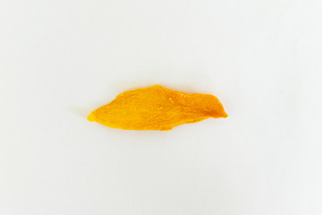 Dried Mango slice on white clear background. Orange fruit. Healthy snack. Mock-up. Copy space.