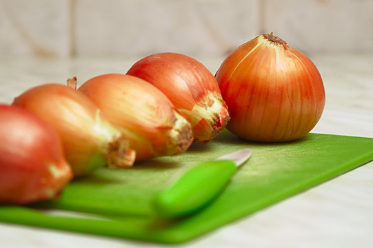 Close-up of onions on the kitchen table.