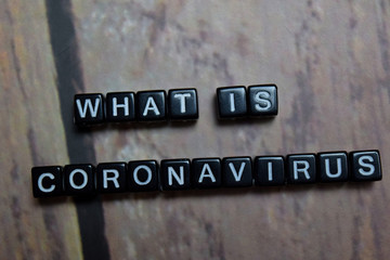 CLose up text What is Coronavirus on wooden block