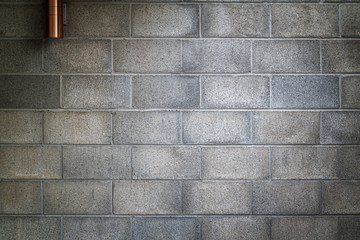 gray colored cement brick background
and texture and wall lamp