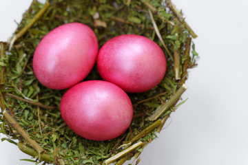 colored eggs TO EASTER. BACKGROUND pink EGGS