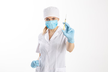 Fototapeta premium Doctor in a white coat holding a syringe.