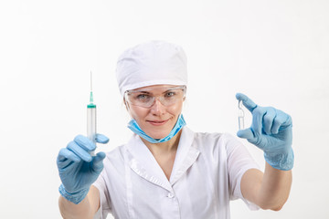 Doctor in a white coat holding a syringe.